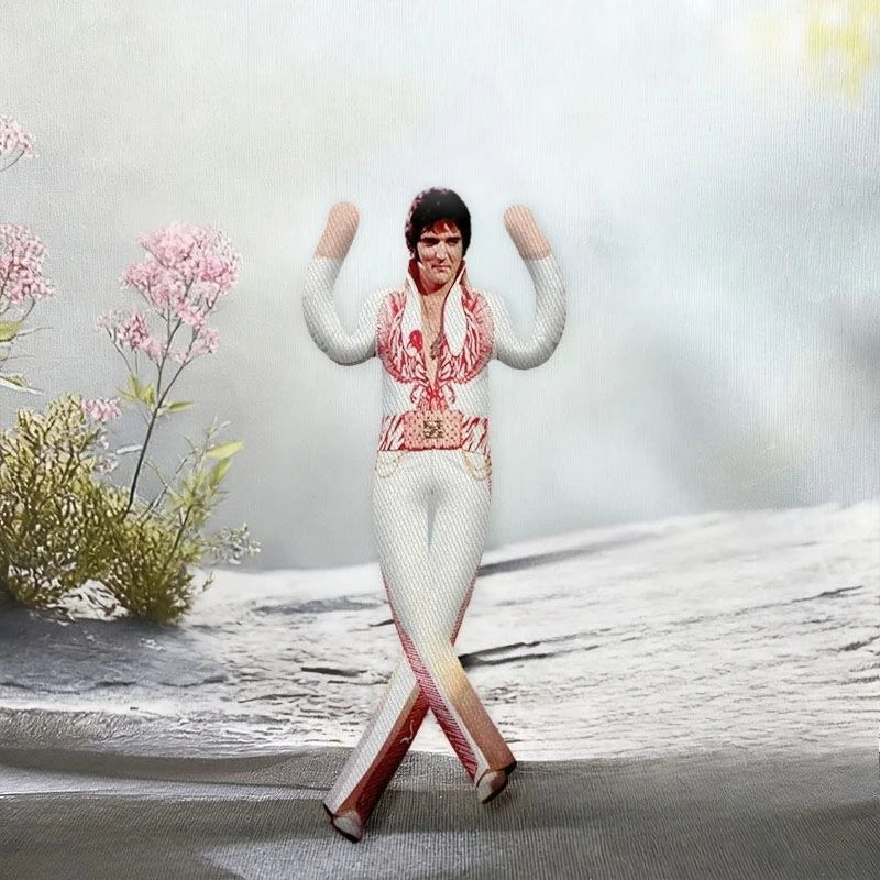 A poseable Elvis Presley Cat King plush doll standing in a snowy outdoor setting.