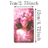 A pink oracle card featuring a woman with pink flowers and a pink blindfold, with text about love and red flags.