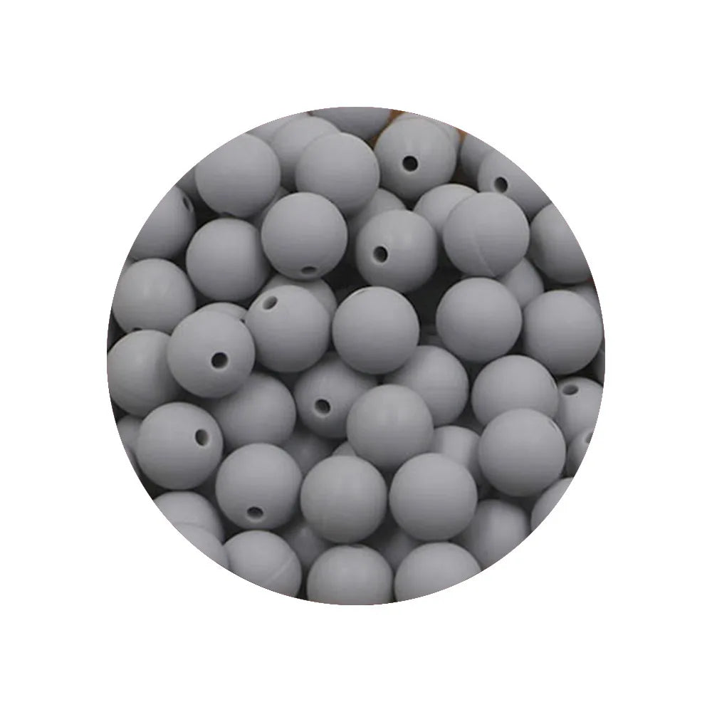 A circular arrangement of small, smooth, gray silicone beads in various sizes.