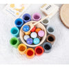 Montessori wooden color sorting game featuring rainbow balls and cups in various colors.