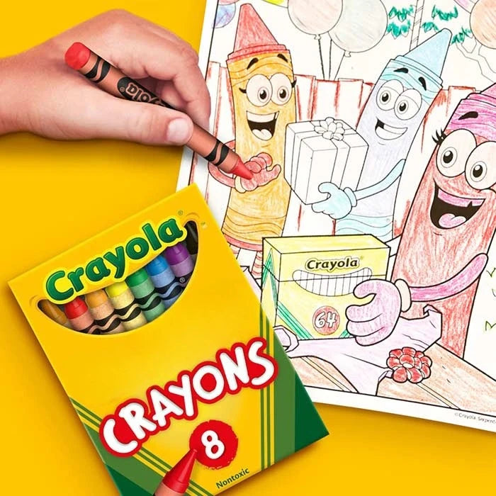 A hand holds a box of Crayola 8 jumbo washable crayons next to a colorful illustration of cartoon characters.