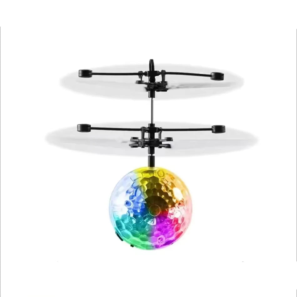 A colorful, iridescent crystal ball is suspended by a black frame, demonstrating gesture-controlled levitation.
