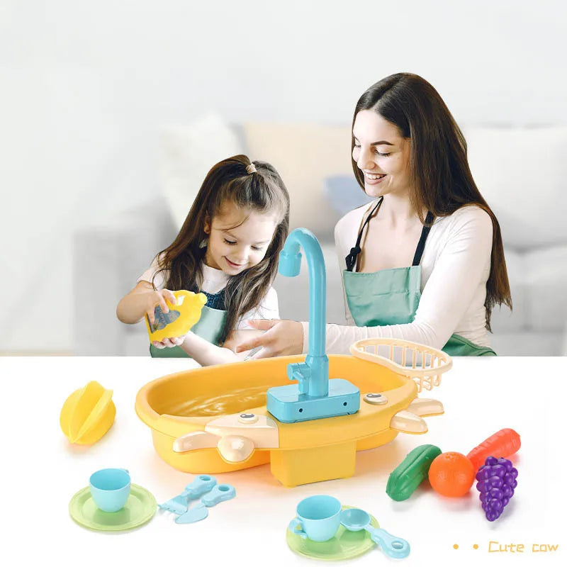 A woman is demonstrating a kids electric play dishwasher set with realistic water cycle to a child.