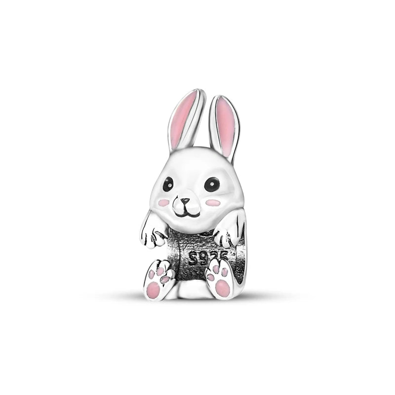 A silver heart charm bead shaped like a rabbit with pink accents.