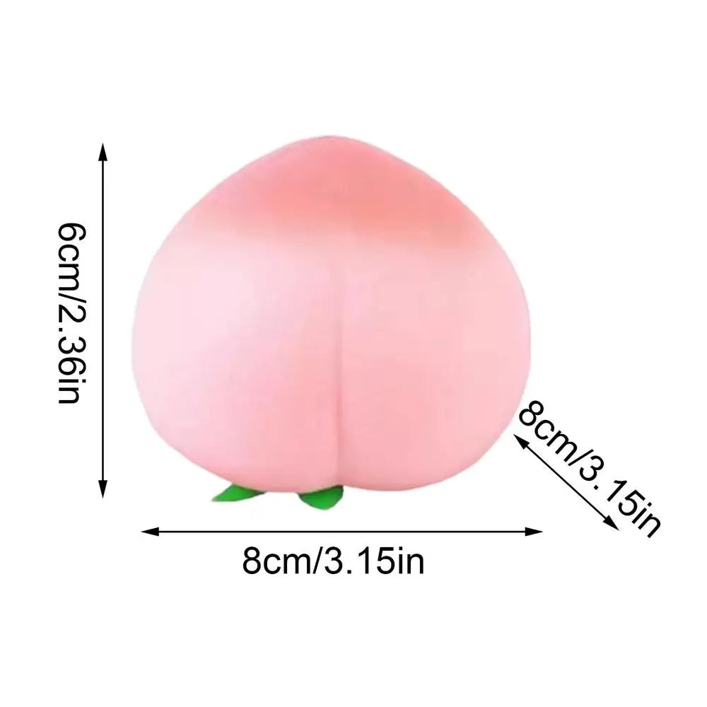 A pink, peach-shaped squeeze toy designed for stress relief.