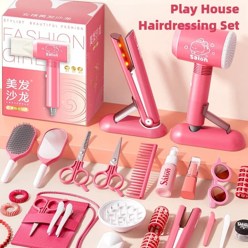 A pink play house hairdressing set featuring various plastic styling tools like blow dryers scissors combs and brushes.