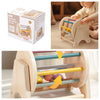 A wooden desktop scrolling drum toy for sensory play, showing various colored wooden bars.
