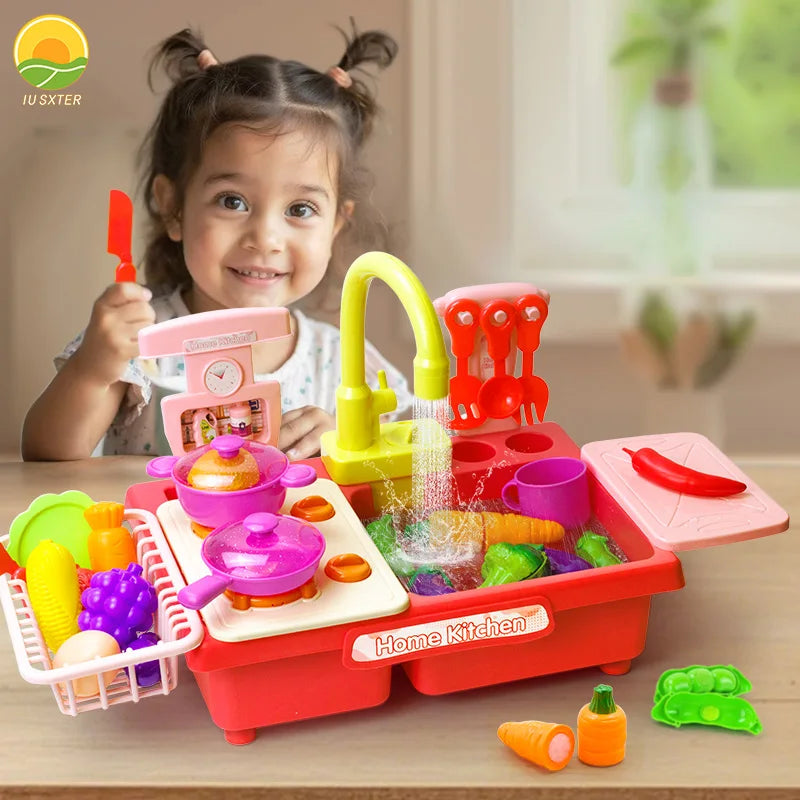 A child is playing with a red and pink electric kitchen sink toy set featuring running water and play food.