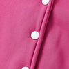 Close-up of a bright pink knitted cardigan with white buttons on the front