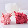 Pink silicone mold of a Highland cow head used for making candles, soap, and crafts.