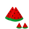 A set of magnetic wooden fruit and vegetable cutting toys, including a watermelon slice.