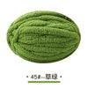 A ball of olive green chunky chenille yarn for hand knitting projects.