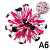 A pink and white expandable magic ball stress relief and breathing exercise toy with black accents