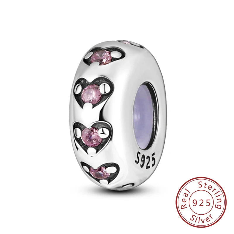 A silver heart charm bead with pink stones is shown against a white background.