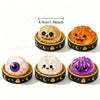 A set of four squishy fidget toys shaped like pumpkins and ghosts with varying textures and colors for stress relief