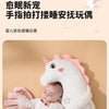 A baby is resting on a white unicorn plush pillow designed for soothing and comfort.