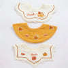 Set of three baby waterproof drool bibs featuring cute animal designs in cream and mustard yellow.