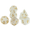 A set of seven polyhedral dice made of translucent white resin with gold numbering and a hazy swirl effect.
