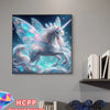 A painting kit featuring a unicorn with iridescent wings and blue accents, displayed next to a stack of books.