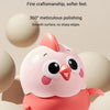 A pink wind-up animal toy chick with large eyes and a rounded body is shown against a light background.