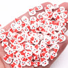 A pile of red and white polymer clay slices assorted for DIY crafts