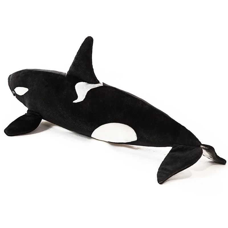 Black and white lifelike orca whale plush toy with a sleek body and dorsal fin.