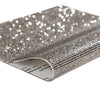 Silver sparkling rhinestone adhesive tape rolled up for DIY crafts and decor
