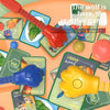 A board game featuring a cat and mouse theme with various colored cards and plastic figures.