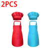 A set of two kids chef aprons and hats, one red and one blue.
