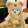 A fluffy teddy bear plush toy wearing a beige outfit.