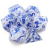 A set of seven translucent blue resin polyhedral dice with floral designs displayed on a white background.