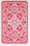 A decorative pattern of swirling red lines on a playing card design.