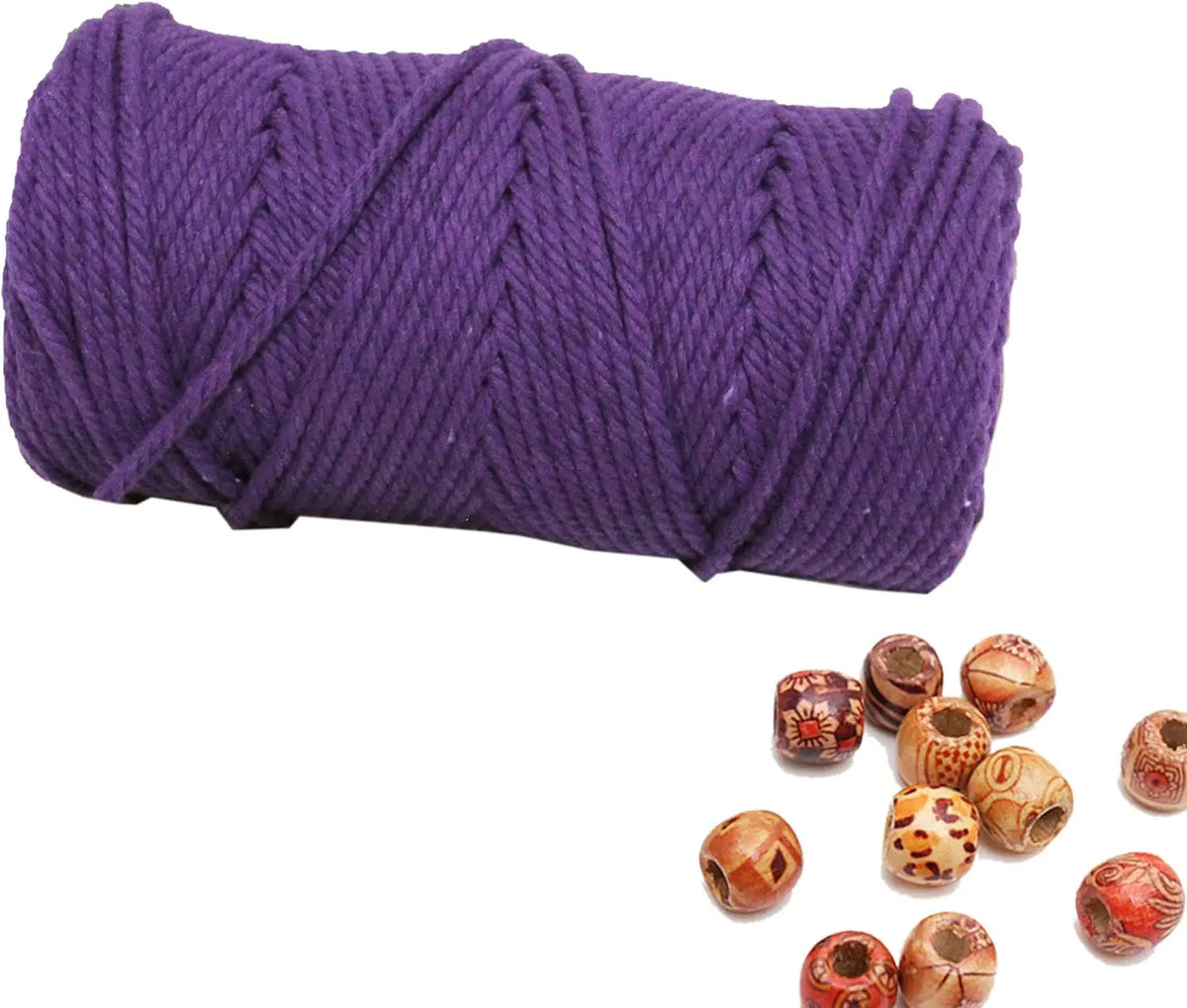 Purple natural cotton macrame rope coiled on a white background with decorative knots scattered below.