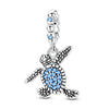 Sterling silver charm pendant set featuring starfish, sea turtle, and whale shark figures with blue stones