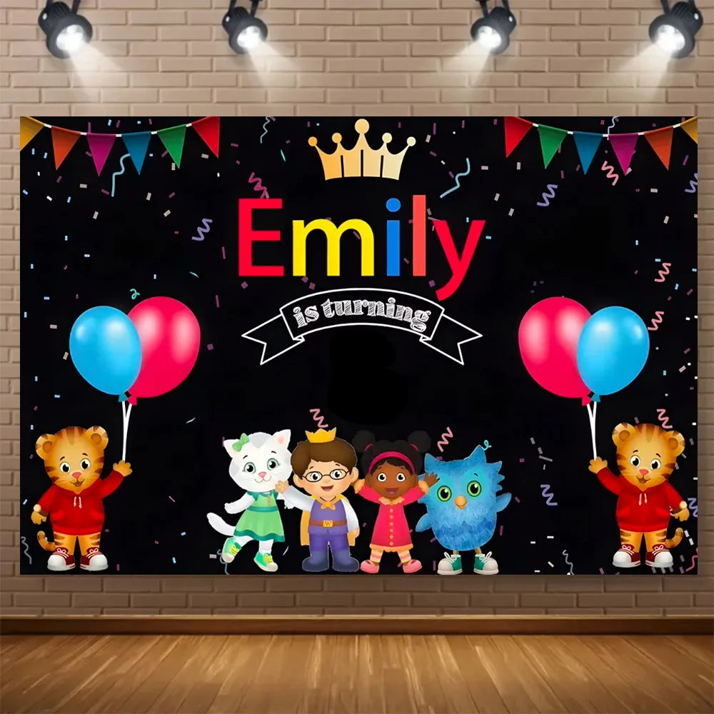 A black backdrop featuring a crown, the name Emily, and several cute cartoon animal characters celebrating a birthday.