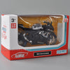 A diecast model of a black Suzuki GSX-R1000R motorcycle is displayed in its packaging box.
