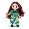 A 16cm articulated BJD princess doll with long reddish-brown hair wearing a green top and camouflage pants.