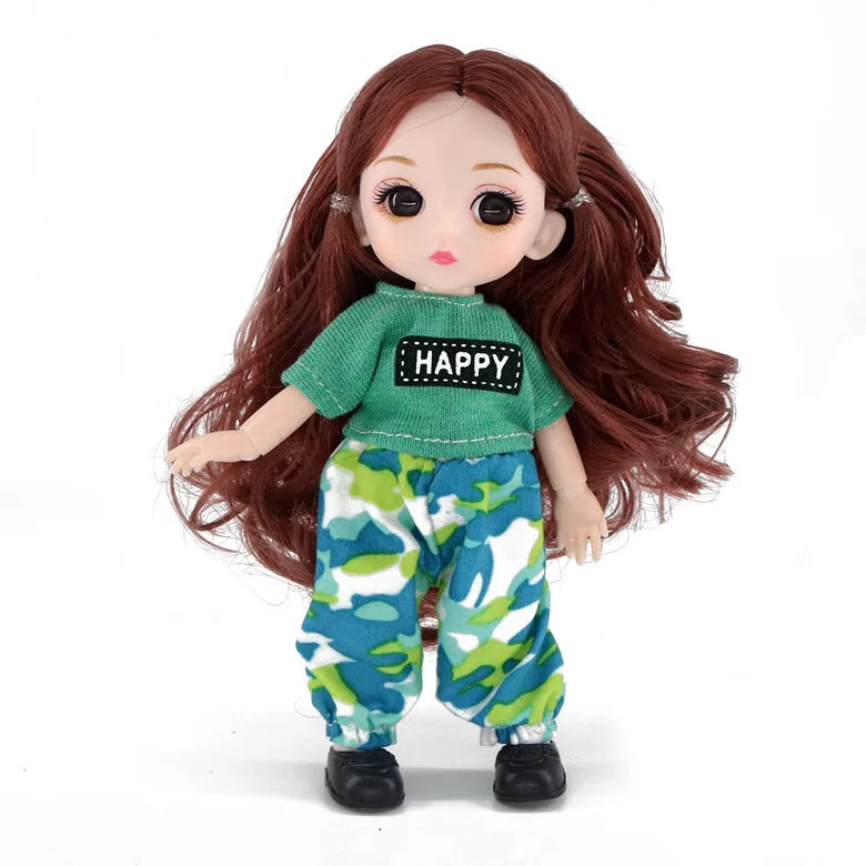 A 16cm articulated BJD princess doll with long reddish-brown hair wearing a green top and camouflage pants.