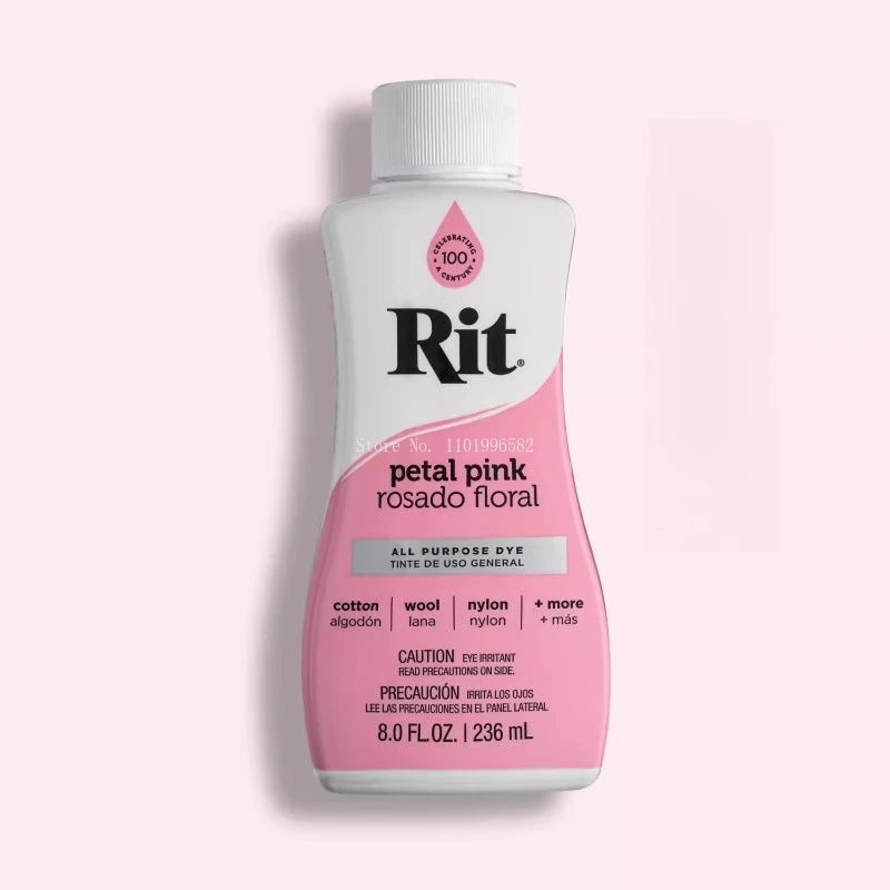 A bottle of Rit petal pink floral multi-purpose fabric dye with a white cap.