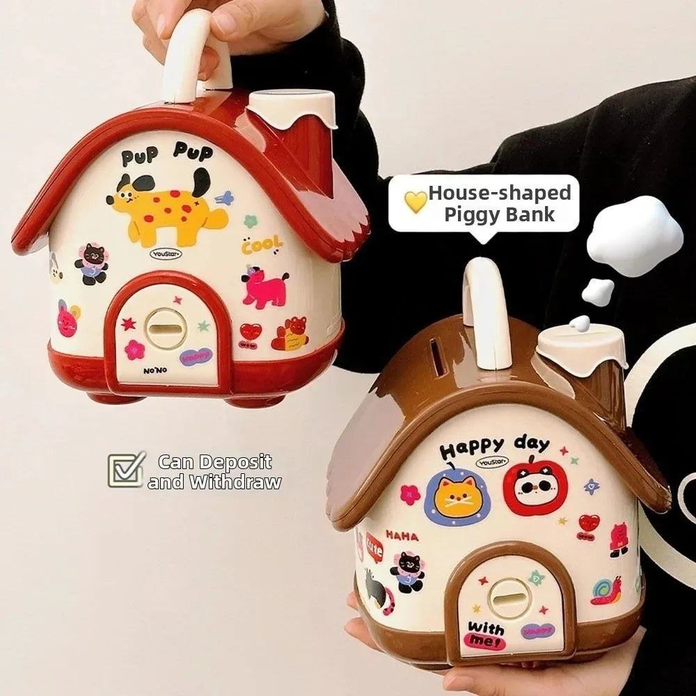 A hand holds a red house-shaped piggy bank with a lock and key, demonstrating its deposit and withdrawal function.