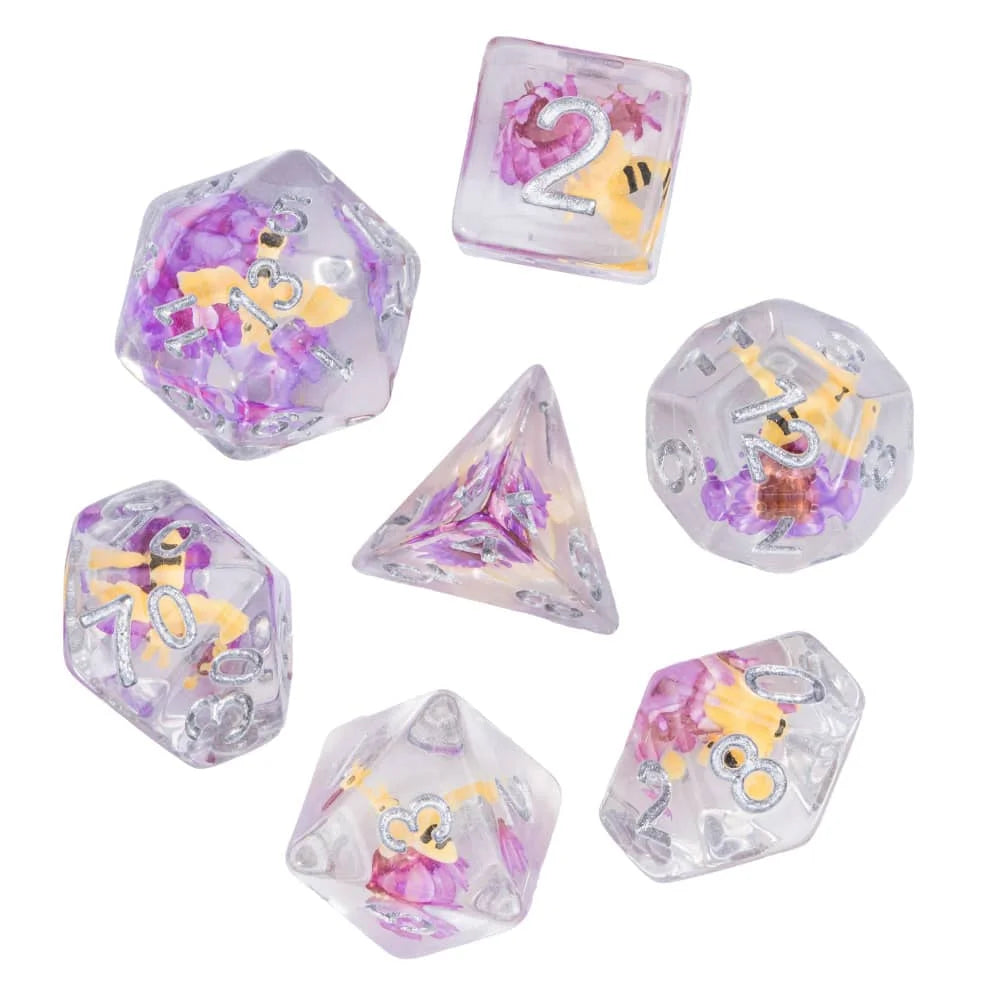 A set of polyhedral dice featuring a mushroom theme in shades of purple and yellow.