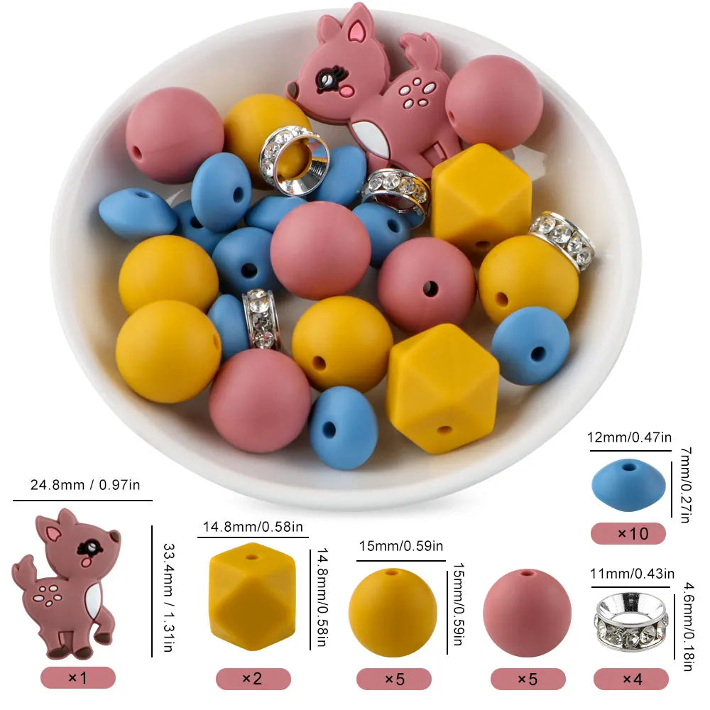 A variety of pink, yellow, and blue silicone beads shaped like cartoon animals are displayed in a white bowl with usage instr