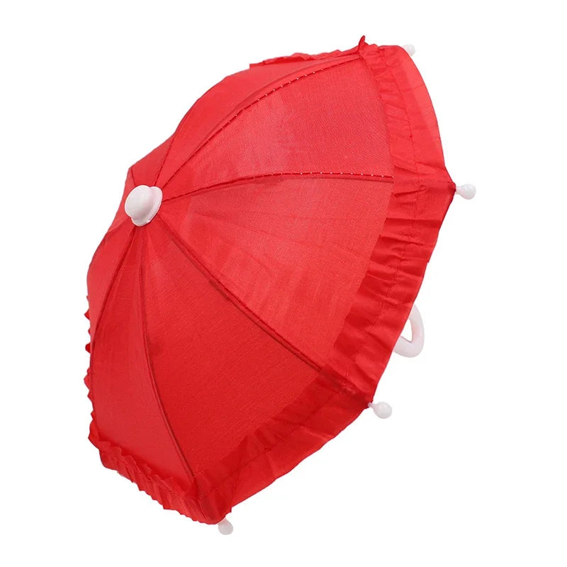 A bright red umbrella with a lace trim and bear design.