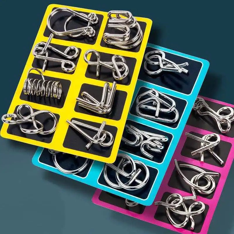 A collection of silver metal wire puzzles and brain teasers arranged in colorful plastic trays.