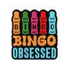 A set of colorful silicone beads shaped like bingo balls in the letters B I N G O and the word OBSESSED