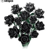 A bouquet of dark black artificial roses made from building blocks.