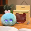 A light blue plush rabbit pendant is displayed next to its packaging box.