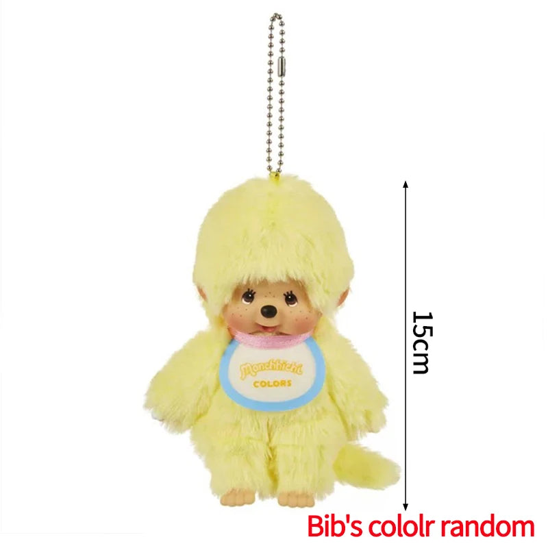 Yellow Monchhichi plush keychain with a light blue collar and a hanging chain