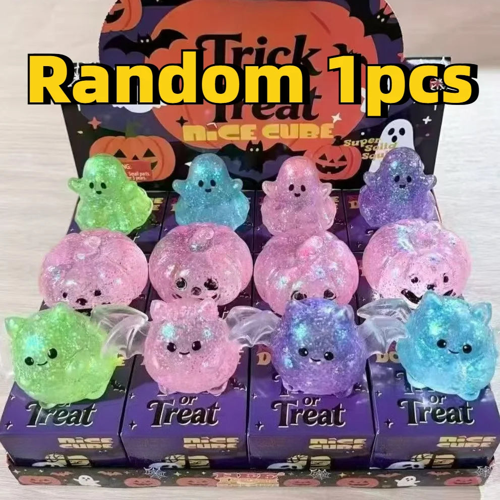 A box of Random 1pcs Treat nice cube stress relief balls in various colors including green, blue, and purple.