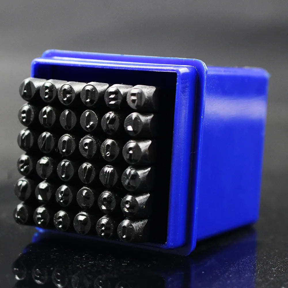 A blue plastic case holding a set of 36 black carbon steel number and letter stamping pins.